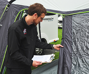 David closely inspects the latest awnings on the test day