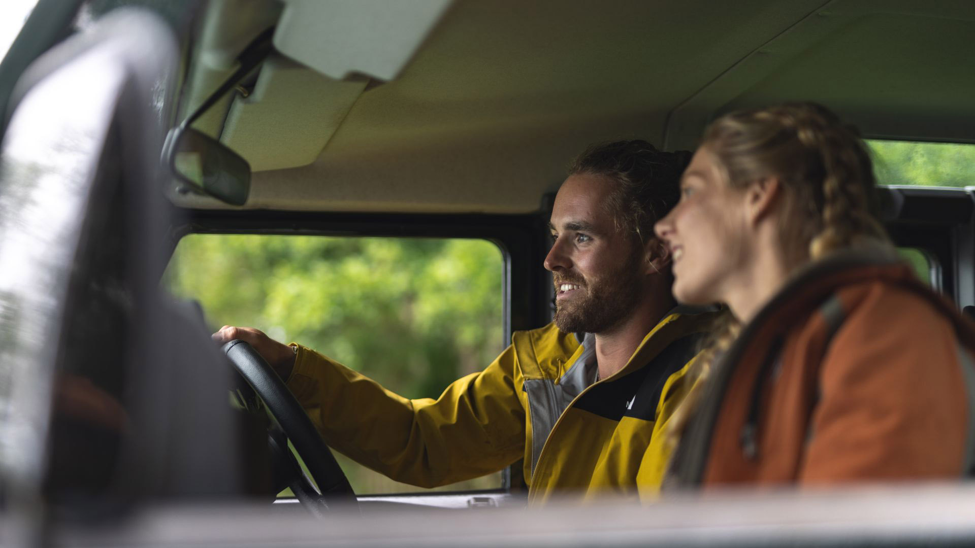 Couple driving campervan