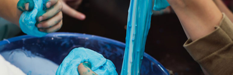 Kids making blue slime