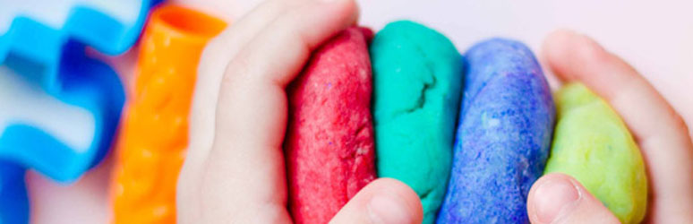 Toddler playing with play dough