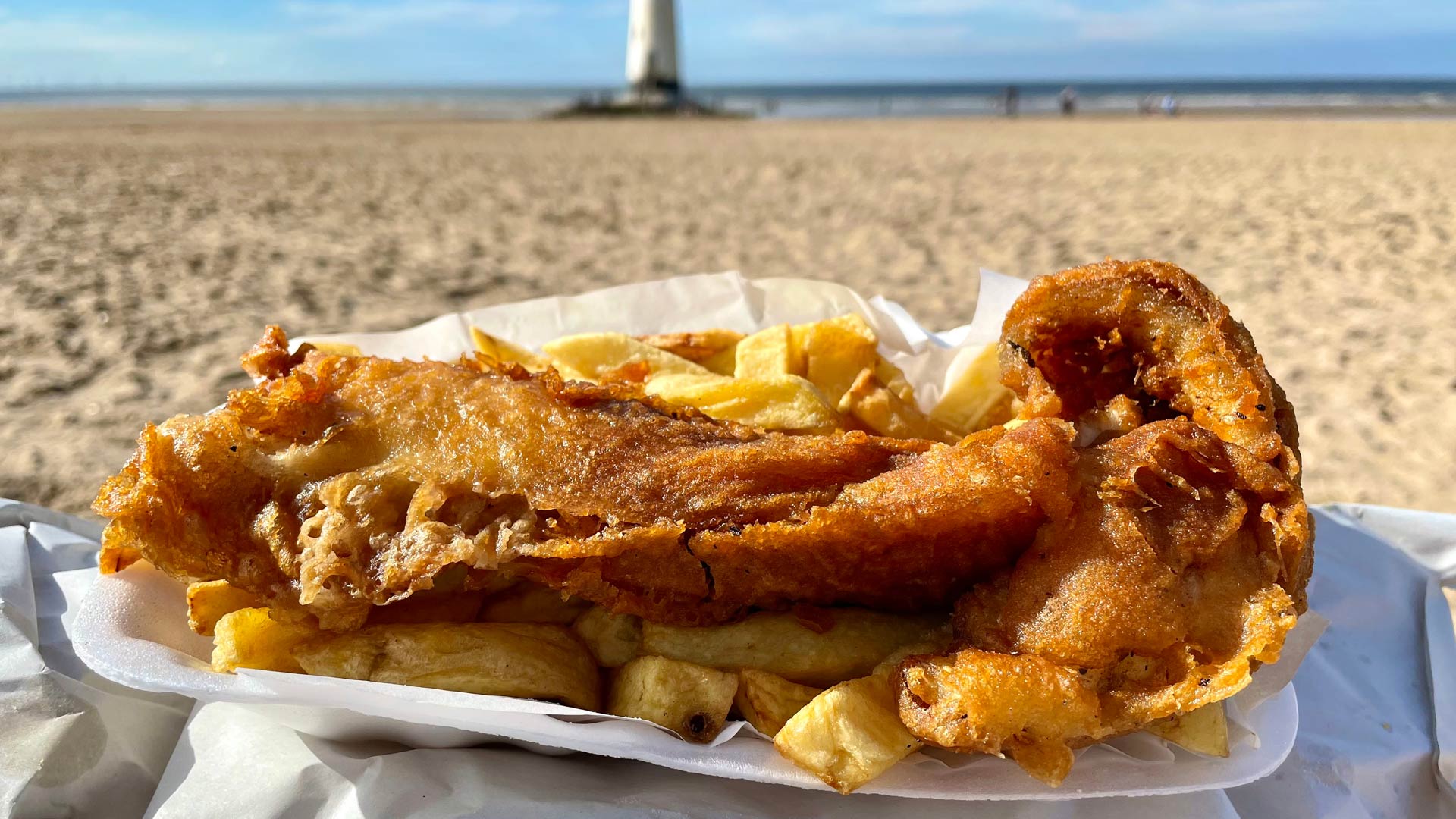 Fish ad chips on the beach