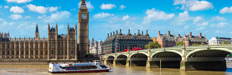 Boat on the River Thames passing the Houses of Parliment