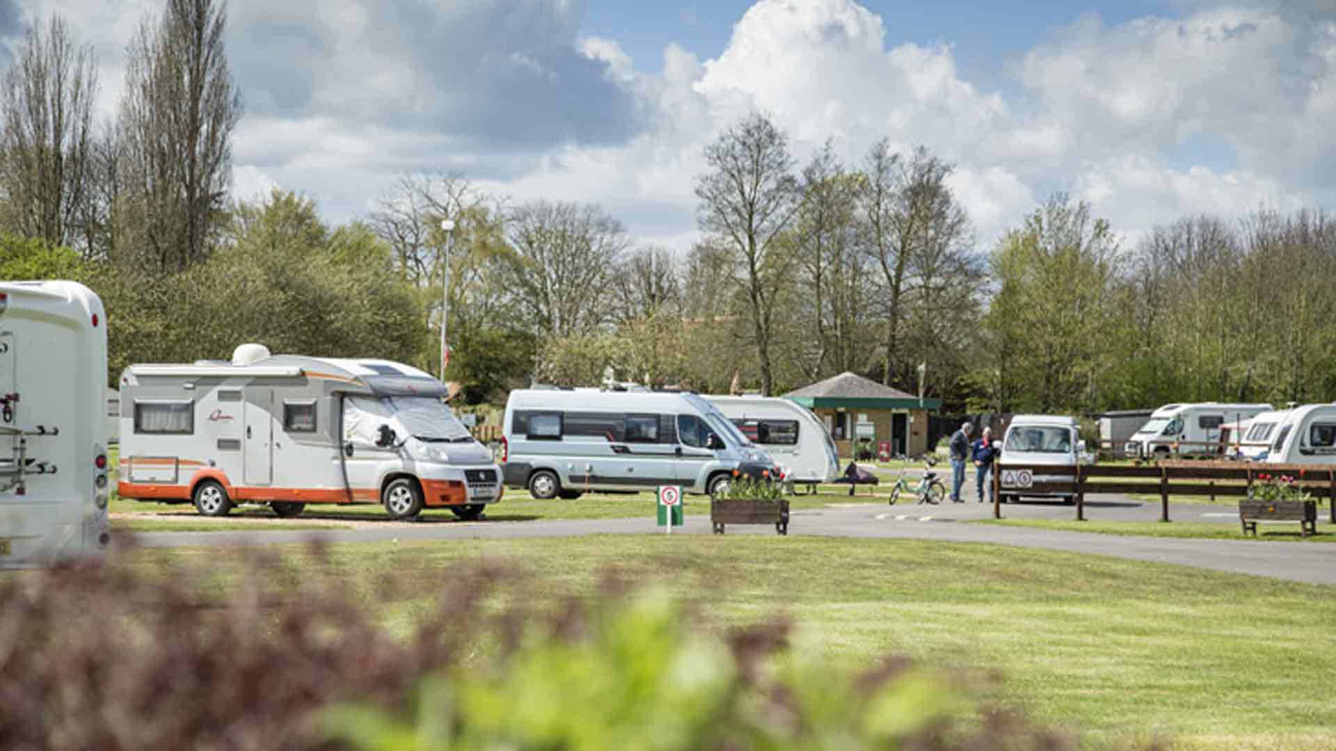 Campervans and caravans pitched up on Cambridge Campsite