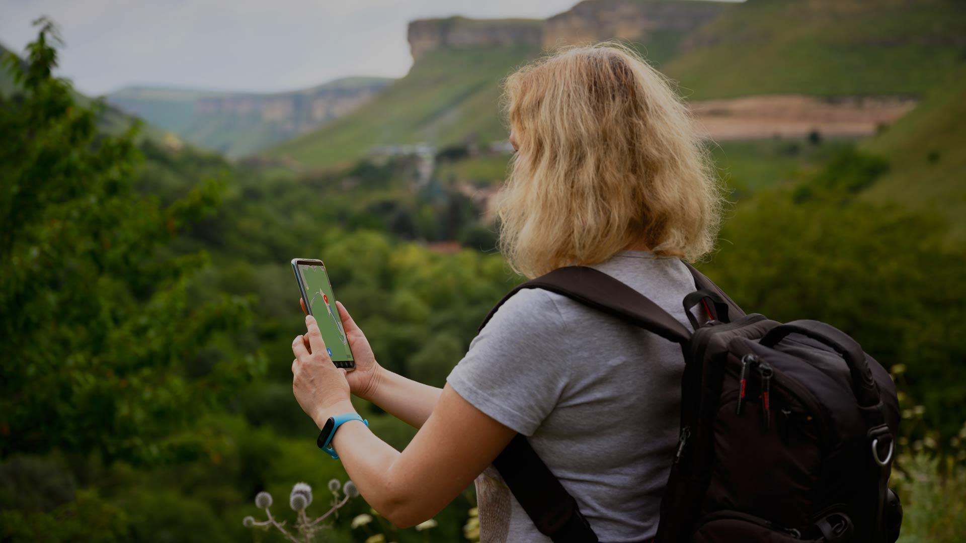 Woman finding a geocache