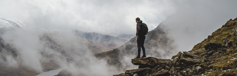 Man looking out from Mount Snowdon 