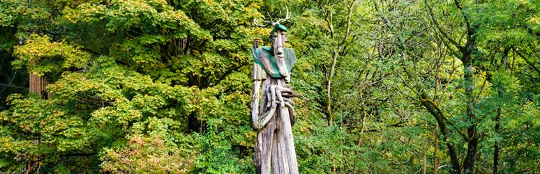 tall sculpture in the forest