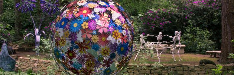 Sculpture of a flower sphere and dancing skeletons 