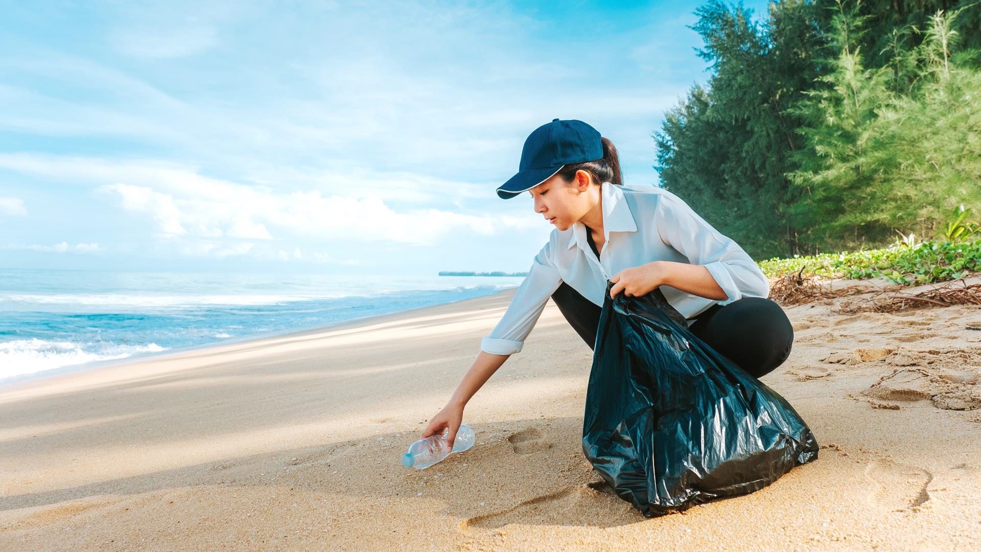 lady cleaning beach