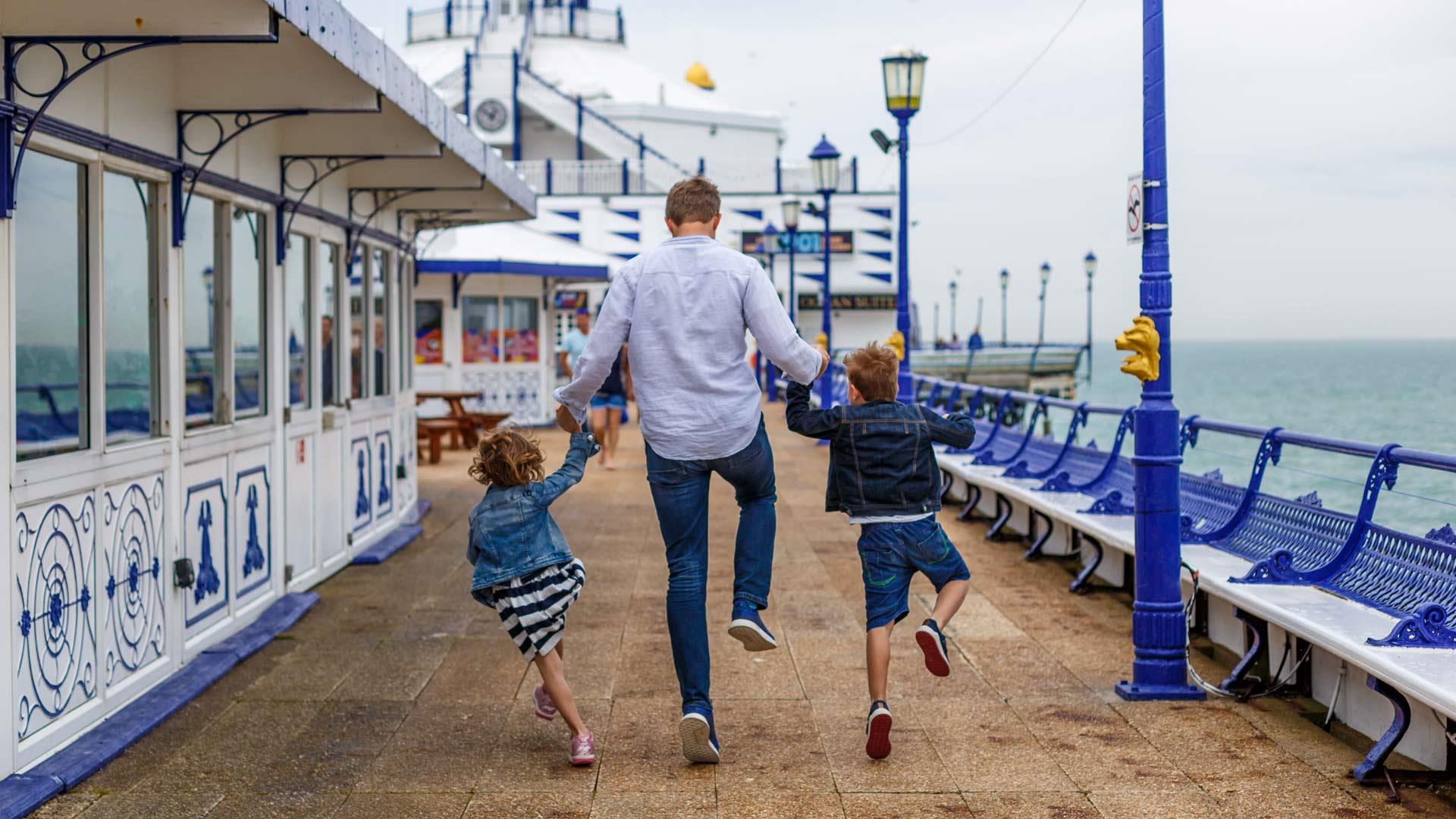 Family enjoying time on Eastbourne Pier