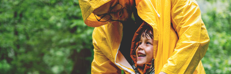 Father and son in the rain