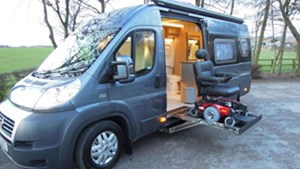 Motorised wheelchair storage in panel built van