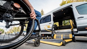 Wheelchair user getting into campervan