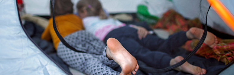 Kids relaxing in a tent