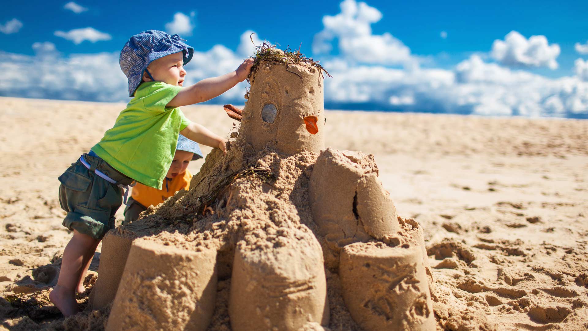 Kids building sandcastles