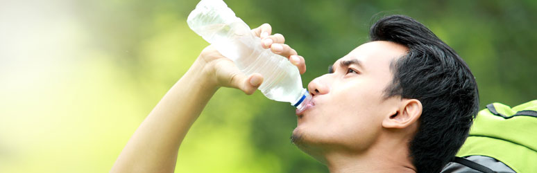 Man drinking bottle of water