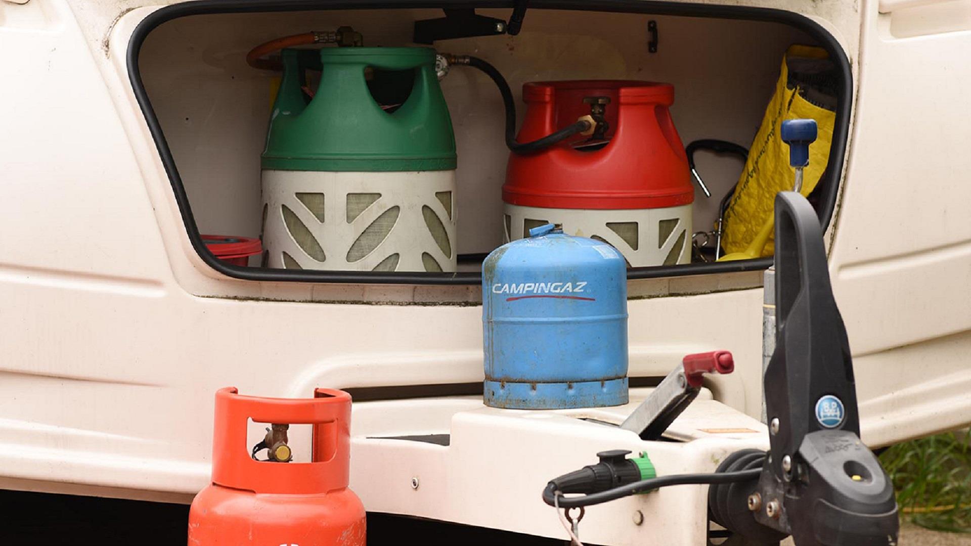 Old gas cylinders in a caravan gas locker