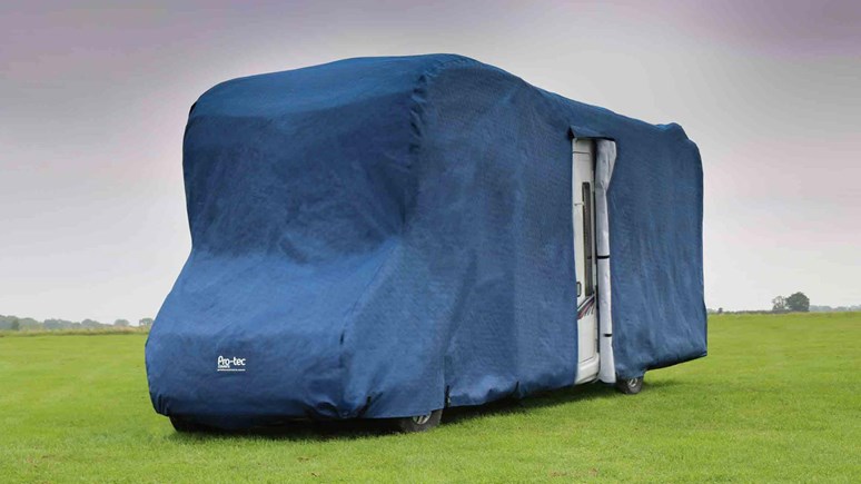 Caravan with winter protective sheet over