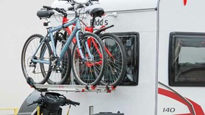 Caravan with bikes and motorbike