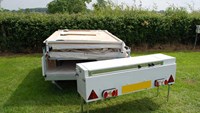 Opening trailer tent