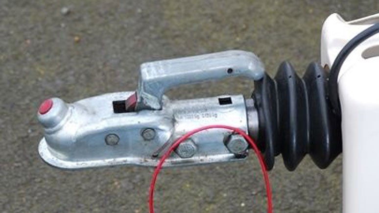 A typical braked trailer hitch with breakaway cable