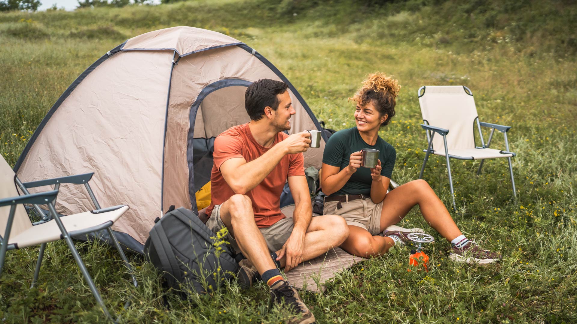Couple outside of tent