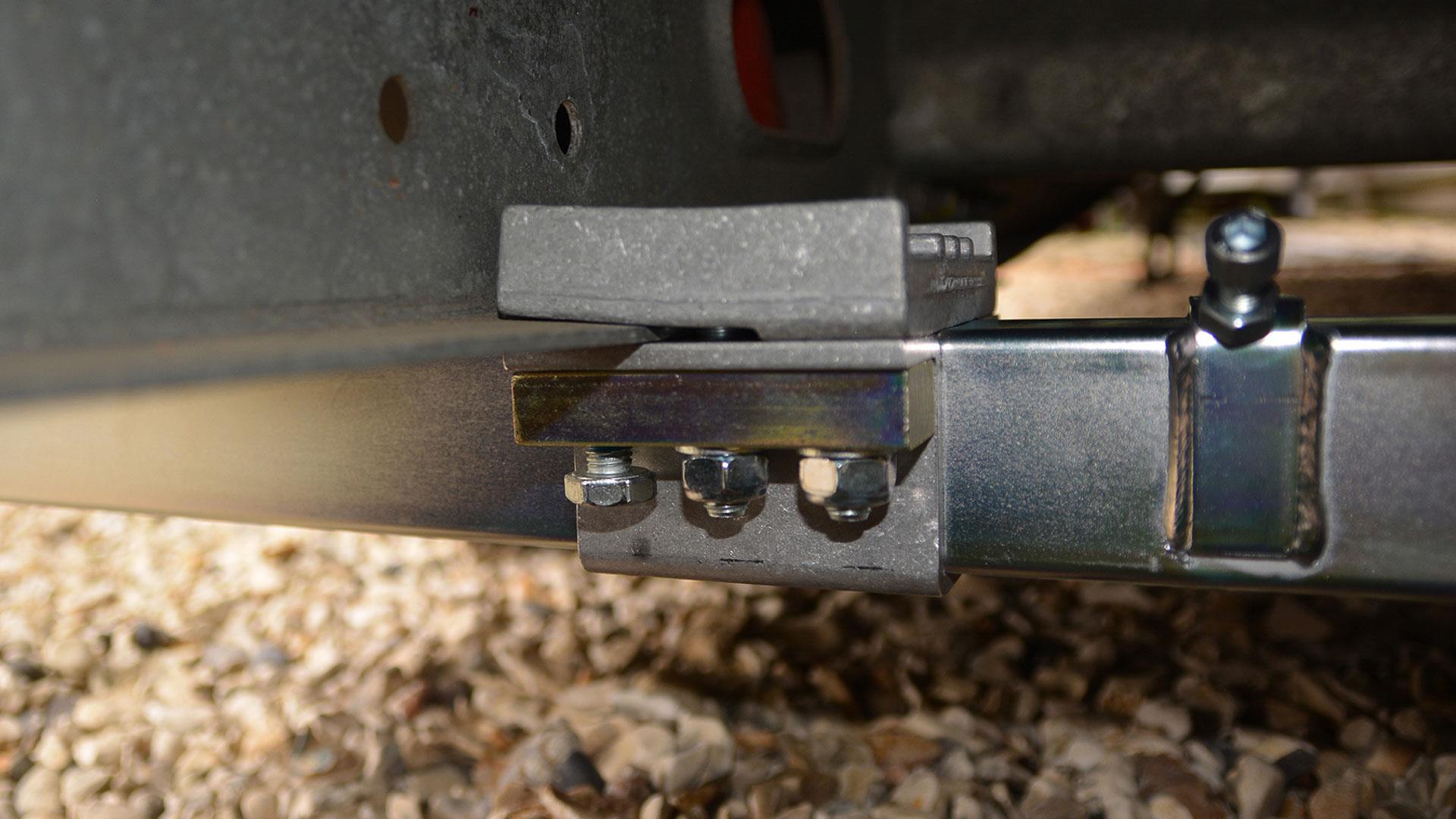Typical mover securing clamp arrangement