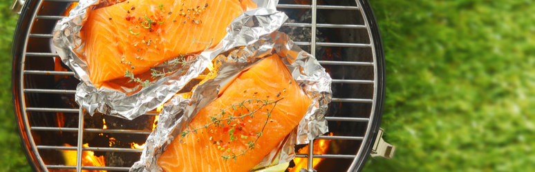 salmon fillets in foil on a bbq