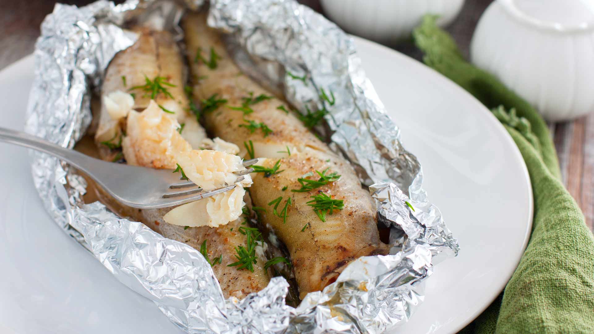 salmon fillets in foil on a bbq