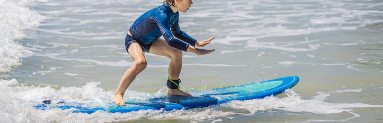 Kid trying to surf