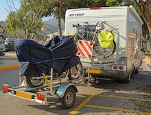 motorbike towed on back of motorhome