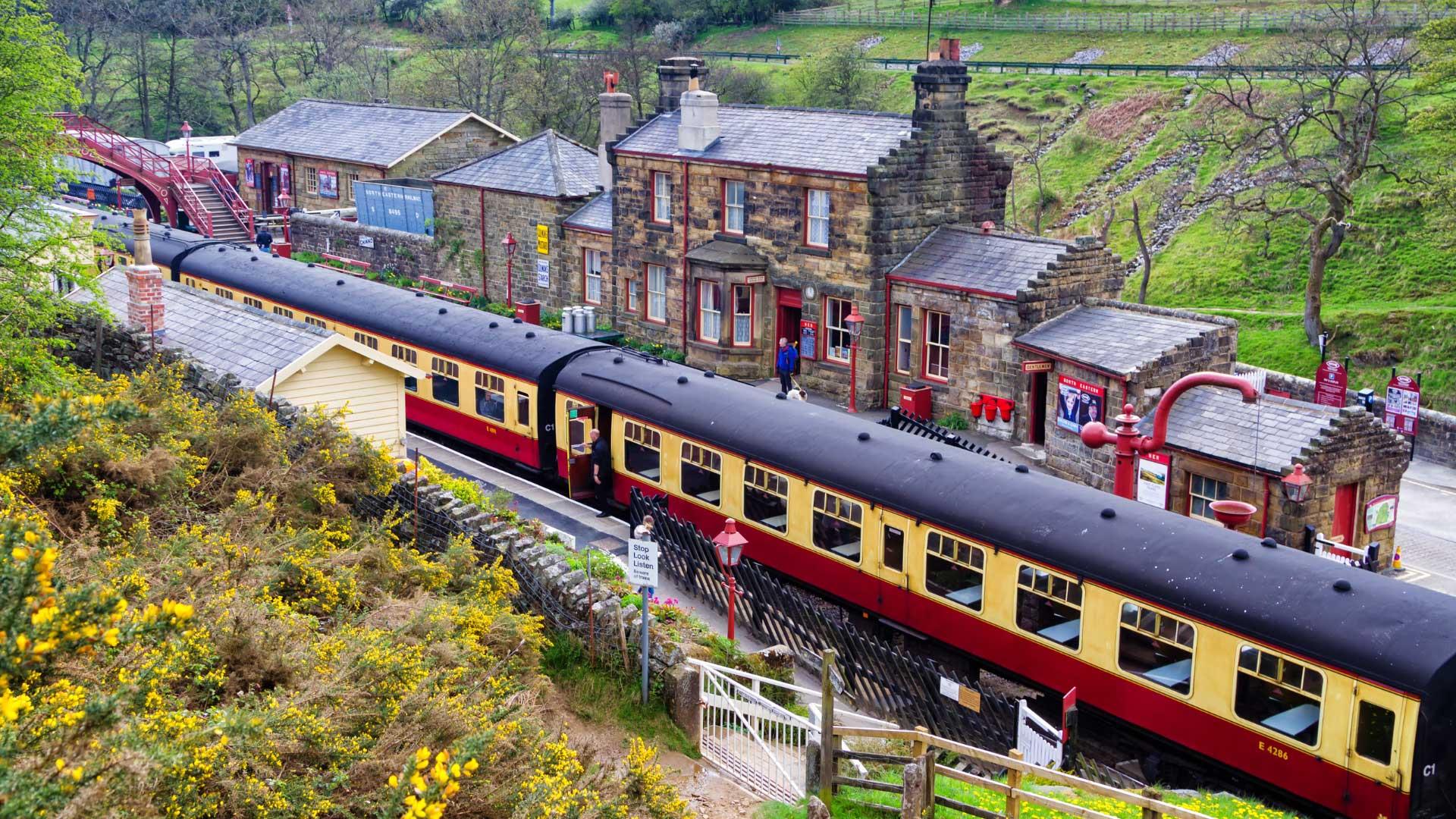Train carriages stoped at an old fashioned rural station