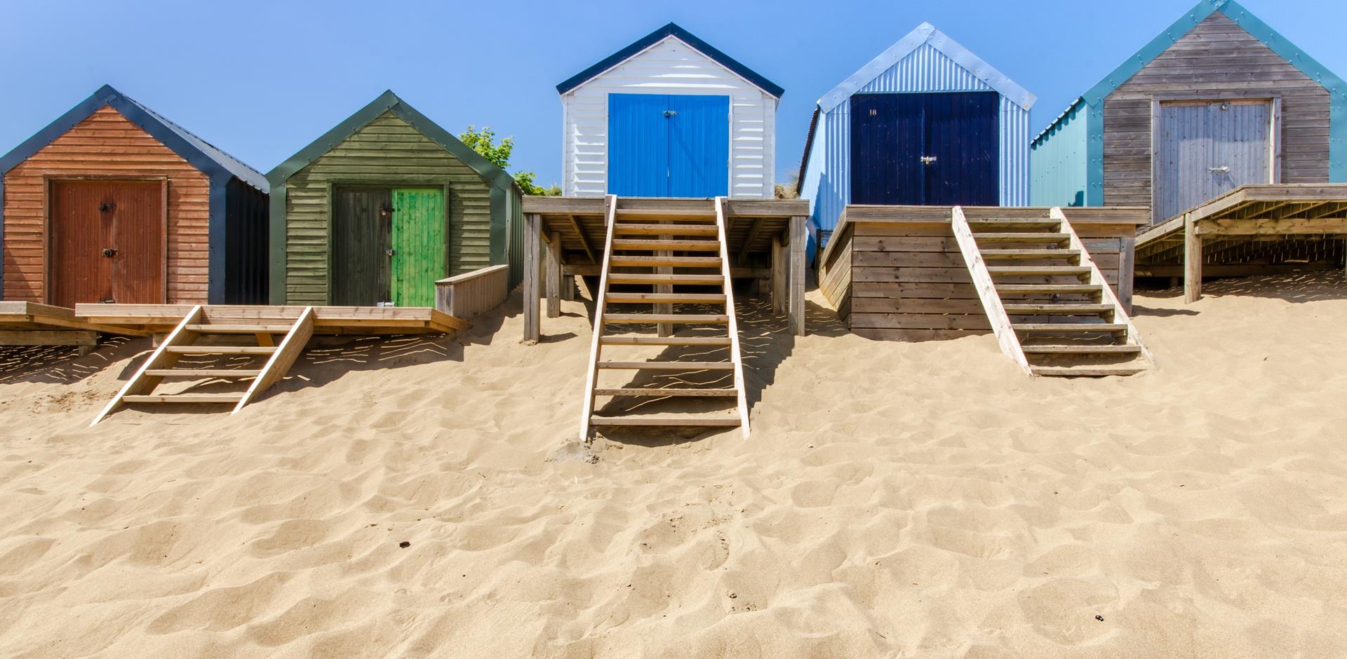 beach huts and sandy beach