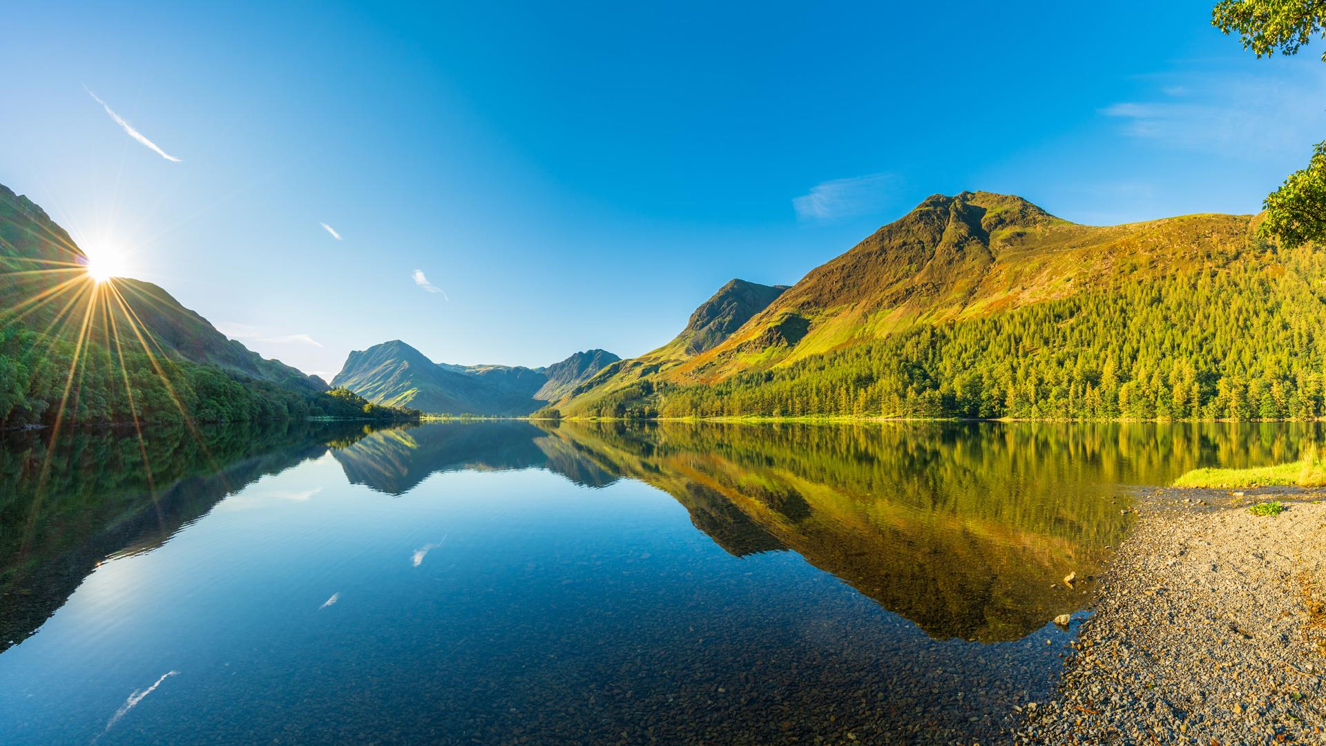 Sun rising over Buttermere Lake, Lake District. England