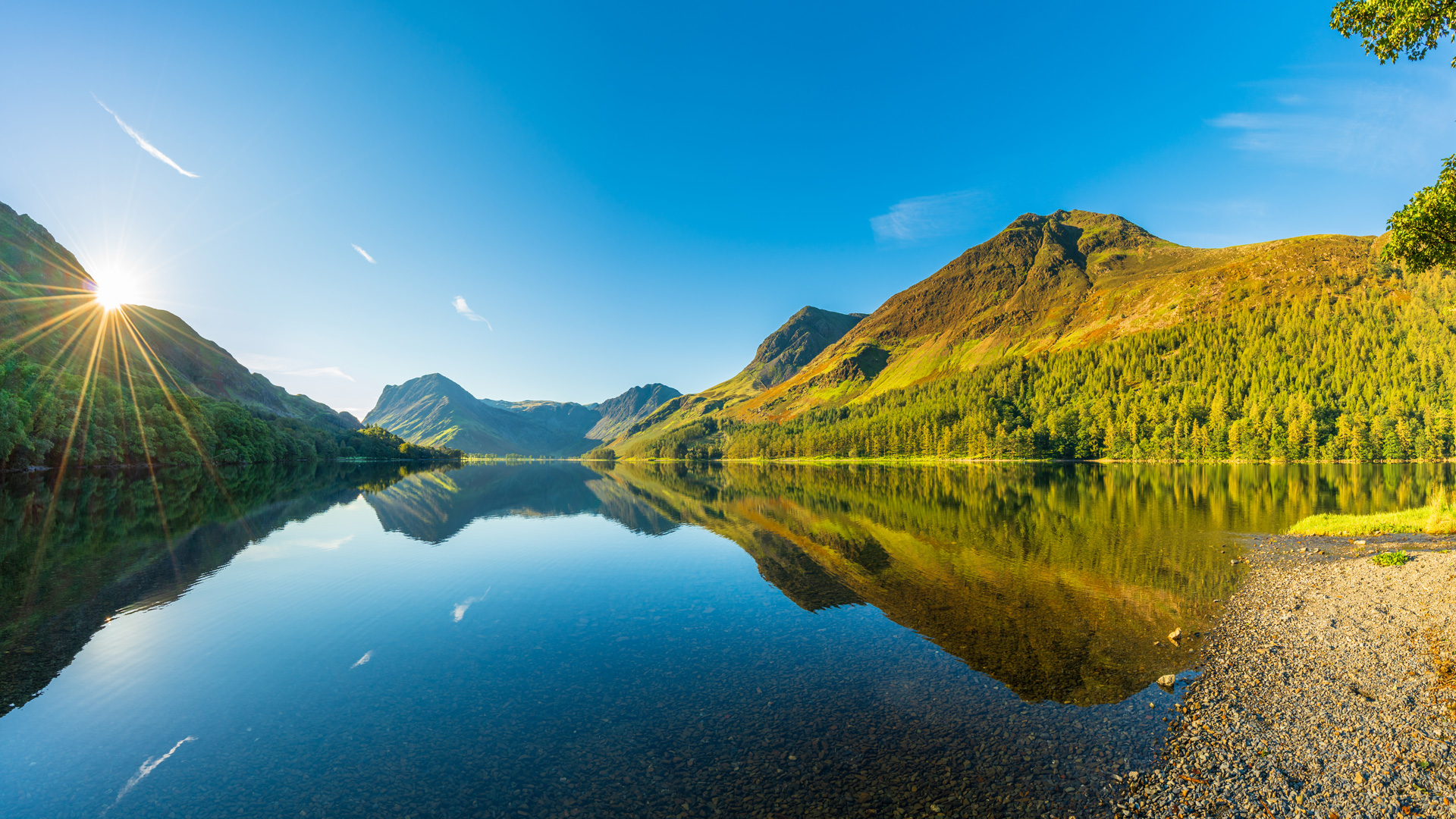 Sun rising over Buttermere Lake, Lake District. England