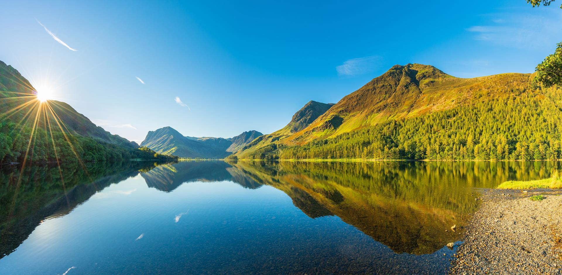 Sun rising over Buttermere Lake, Lake District. England