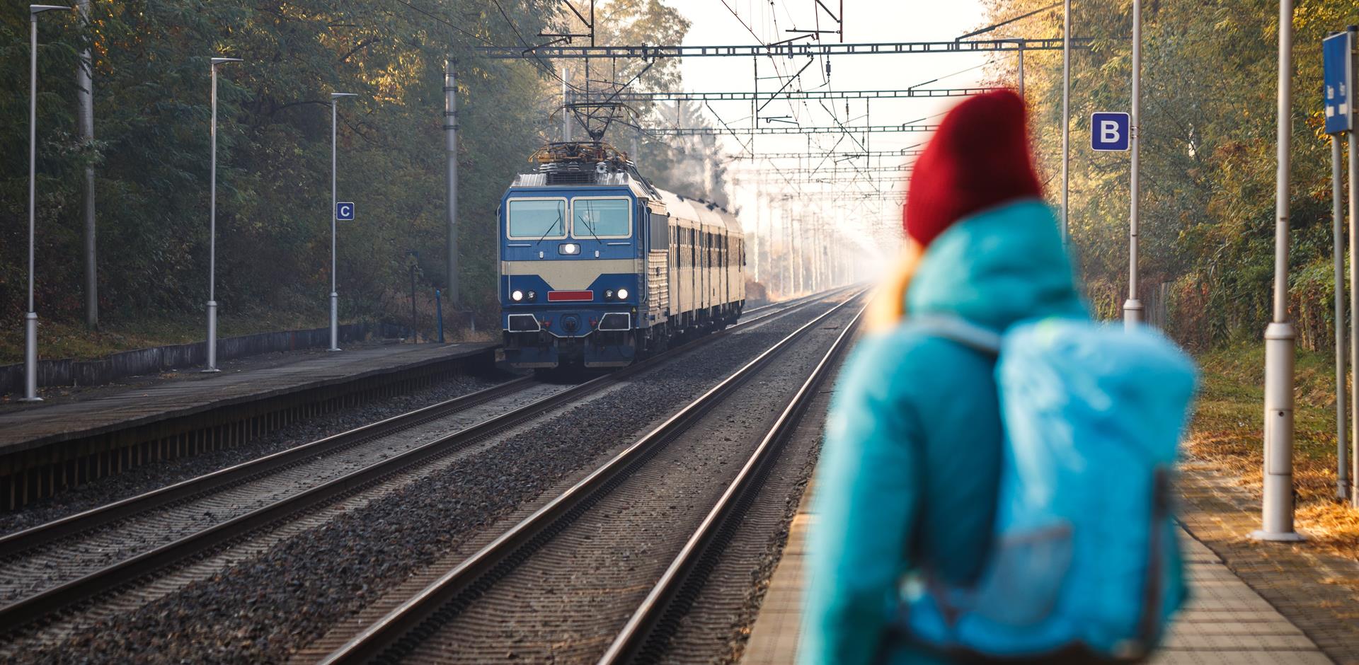 backpacker waiting for train