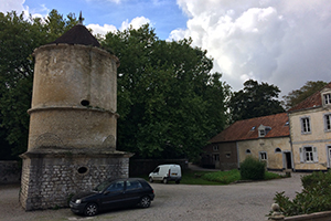 A dovecote from the 1500s at the courtyard on site at La Bien Assise