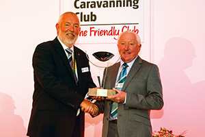 Les Morton of the Walking and Cycling Section receives the Burnham Trophy from Club Chairman Bob Talbot (left)